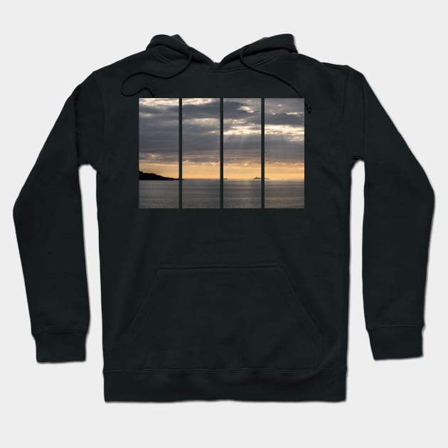 Wonderful landscapes in Norway. Vestland. Beautiful scenery of a cargo boat in the calm sea at the sunset in a cloudy day with sunrays through the clouds. Yellow sky Hoodie by fabbroni-art